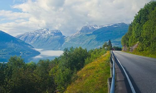 Beautiful landscape with norwegian road, fjord and mountains