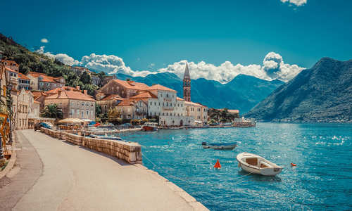 Harbour and boats in sunny day at Boka Kotor bay, Montenegro, Europe