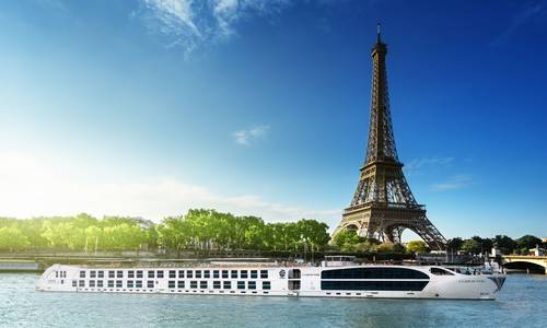 The SS Joie de Vivre in front of the Eiffel Tower